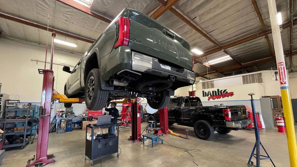 The 2022 Toyota Tundra on the lift in the Banks work shop
