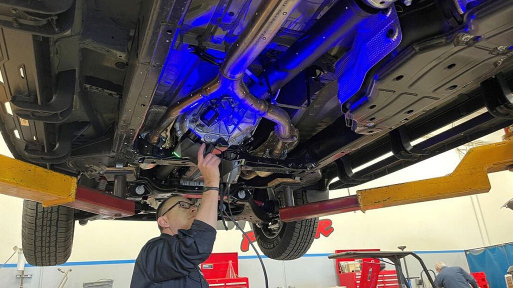 An engineer uses a 3-D scanning device to bring the undercarriage of the 2022 Toyota Tundra into CAD.