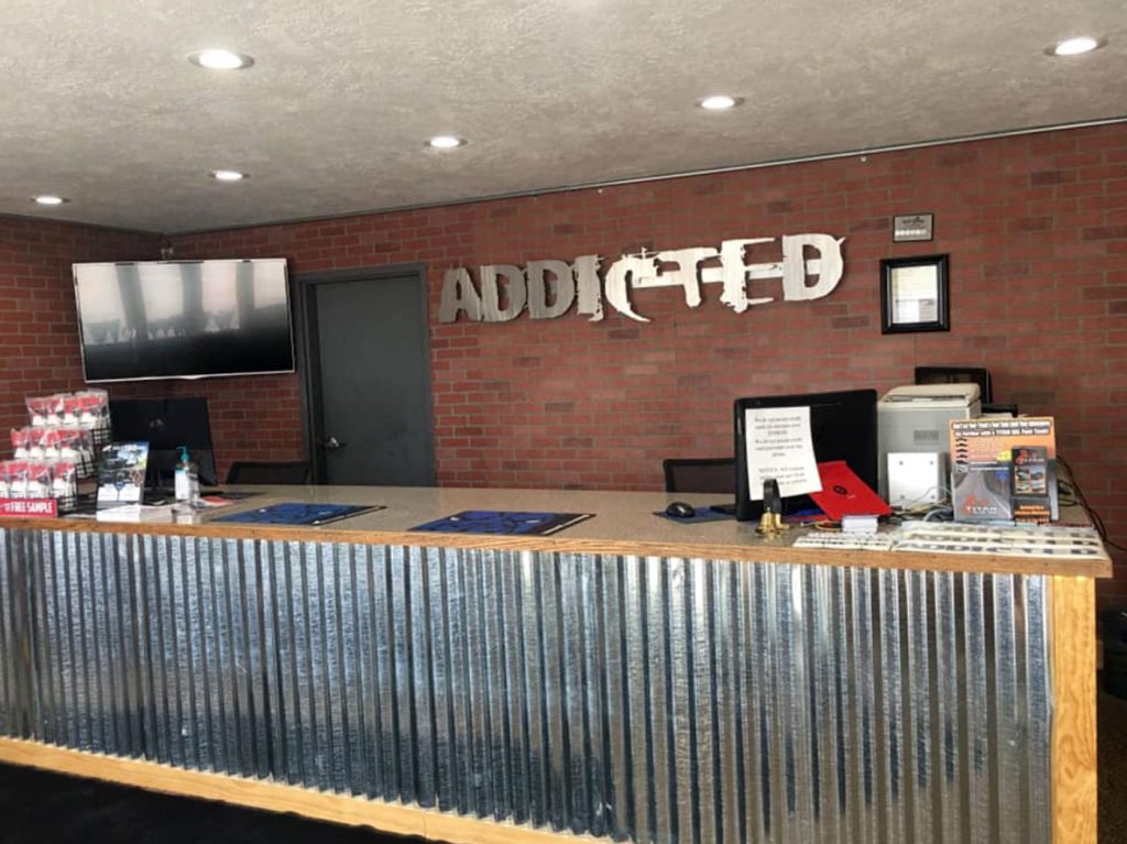 The Addicted Performance reception desk and interior.