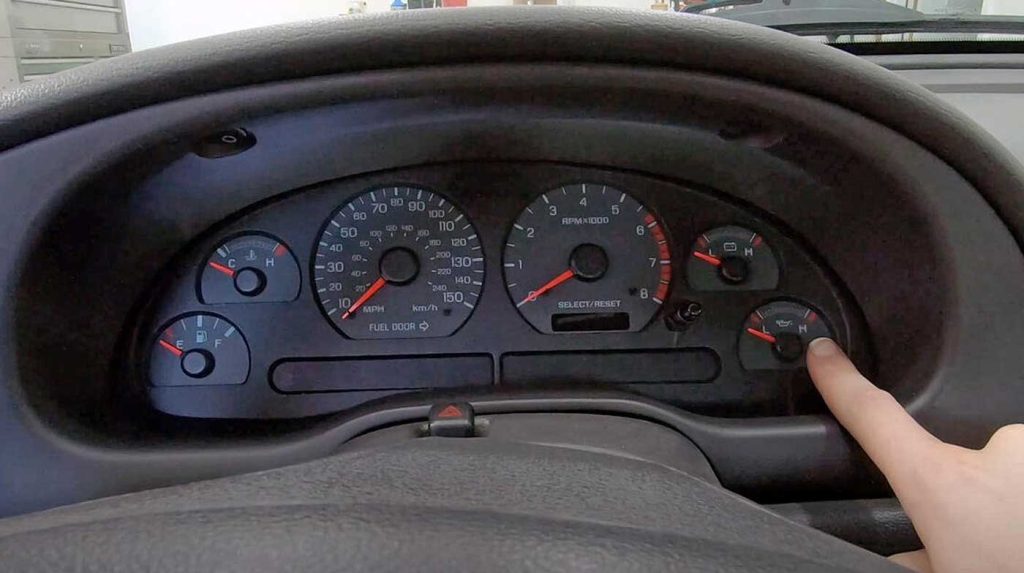 The old car's dash lacks critical information.