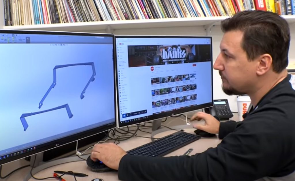 Matt Gamble draws the brackets in CAD which will help support the custom airboxes