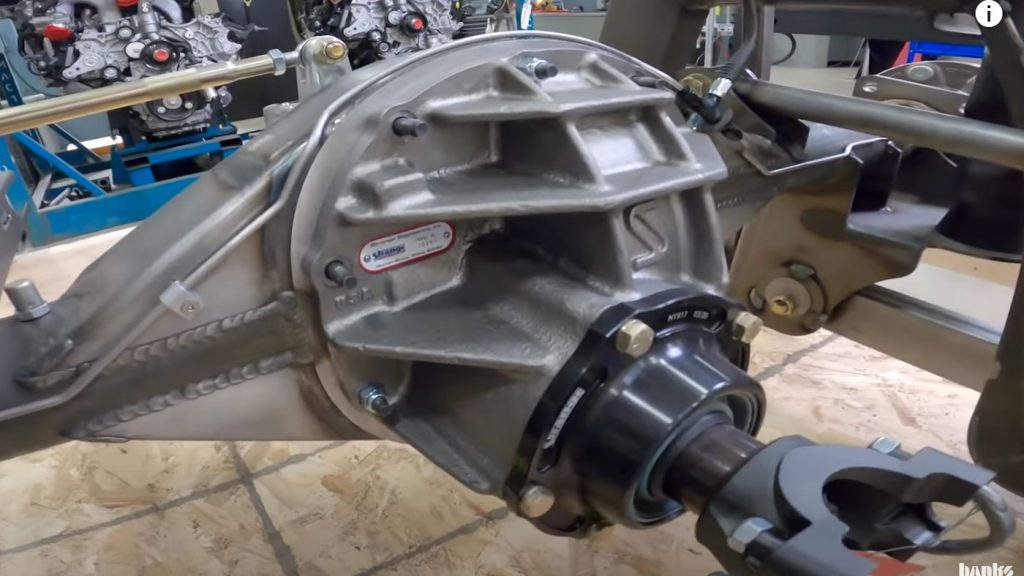 Unboxing the chassis reveals the custom 8-lug axle from Strange Engineering.