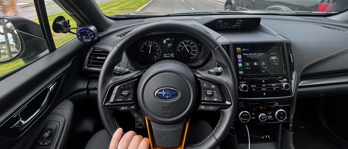 The cockpit of the Subaru displaying the Banks iDash.