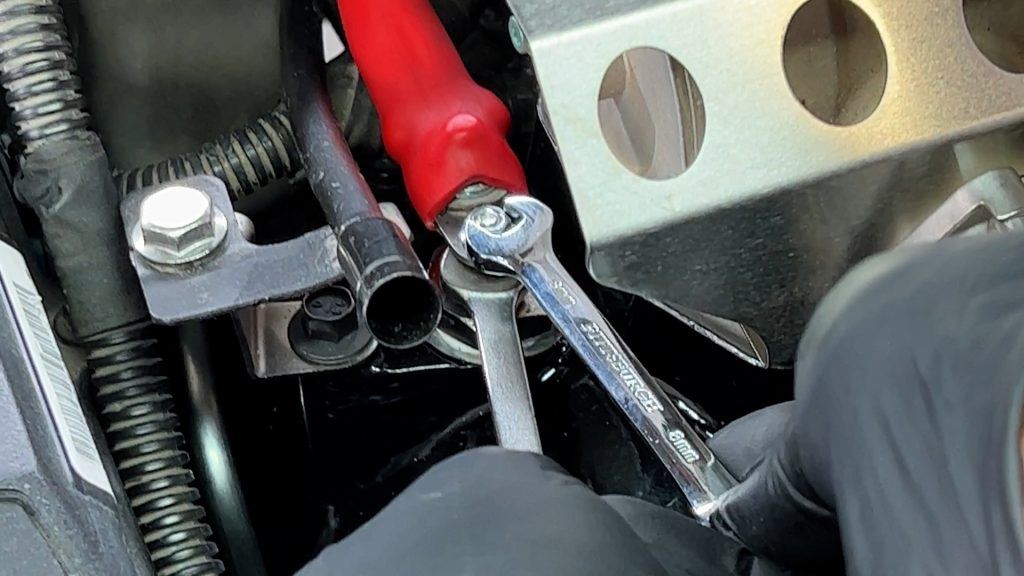 Tighten stud with wrench