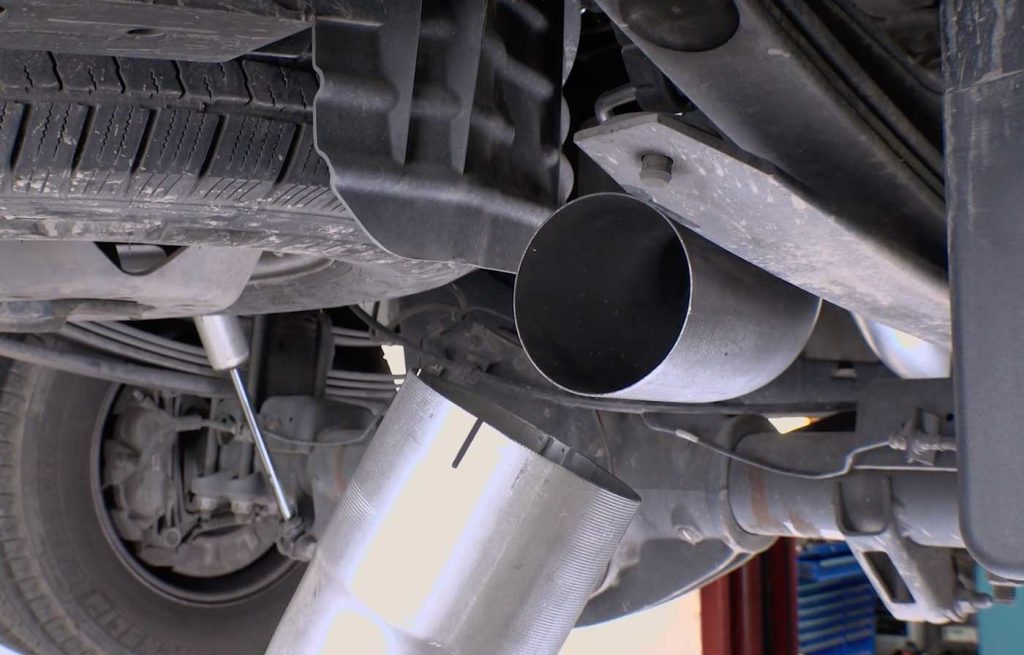 Retrieve the mid-tailpipe section, and place a 5" clamp over the tip.