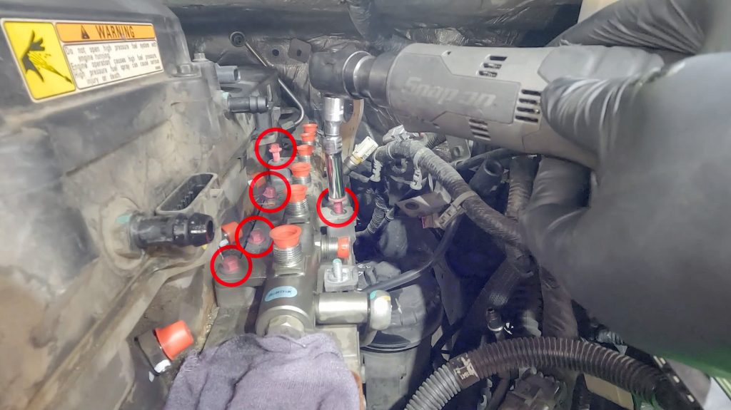 Remove fuel rail bolts