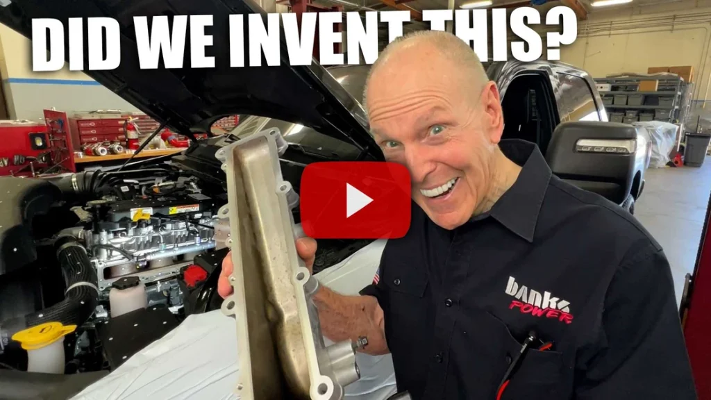 Gale Banks holding Cummins side draft intake manifold