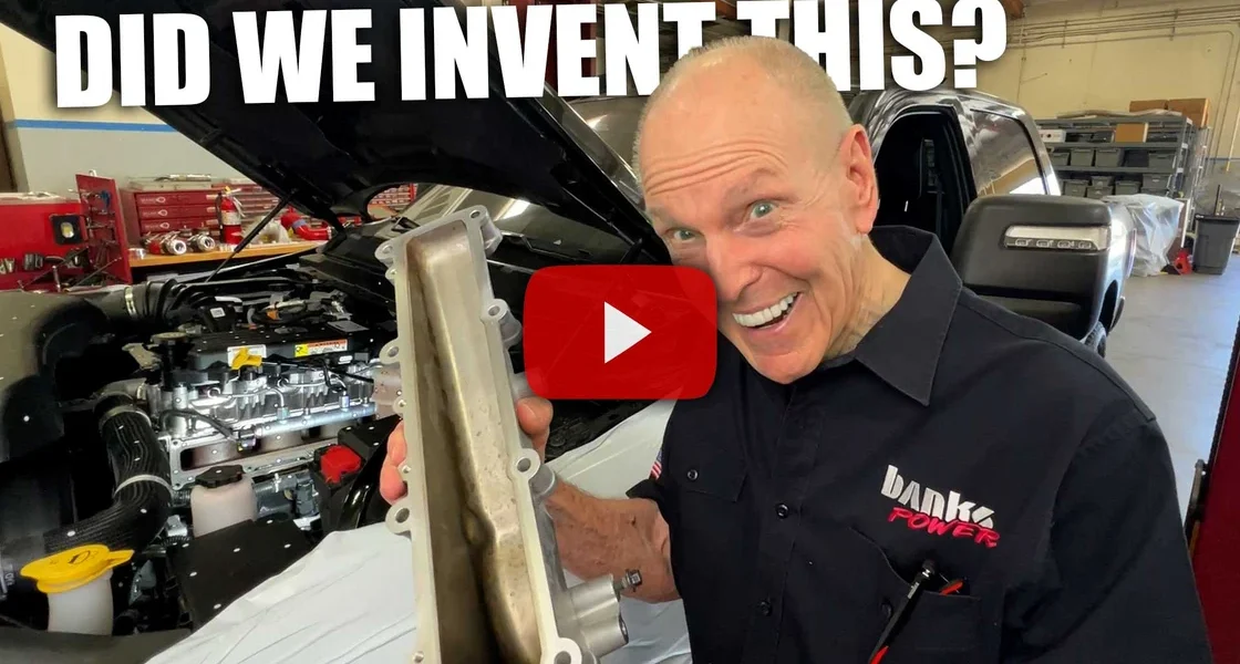 Gale Banks holding Cummins side draft intake manifold