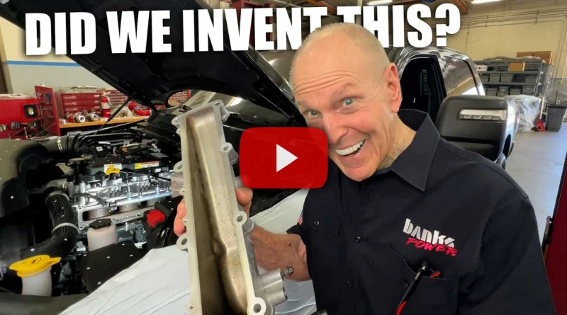 Gale Banks holding Cummins side draft intake manifold
