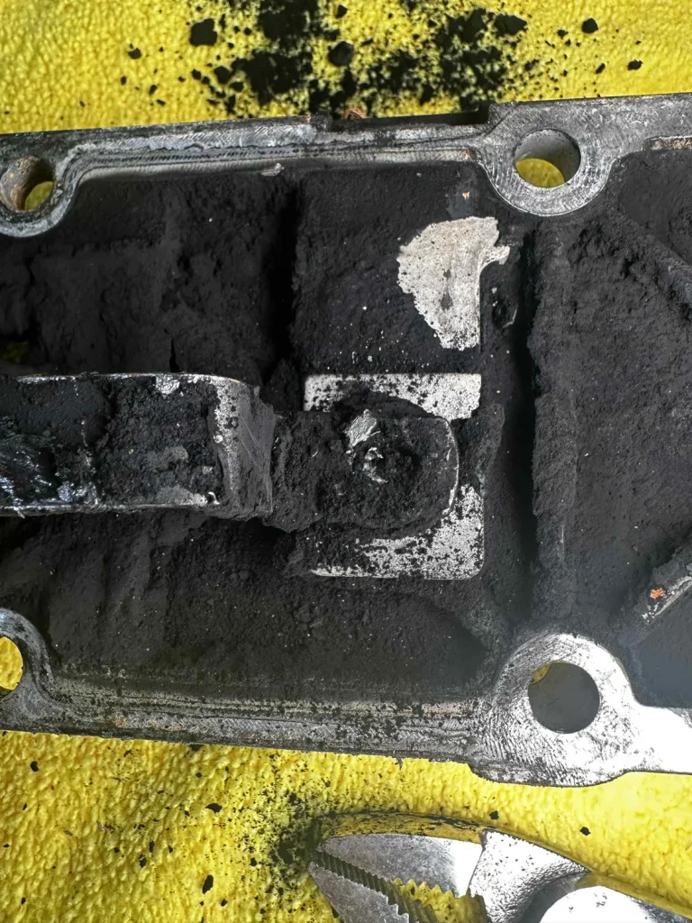 Close-up of clogged grid heater failure on Cummins
